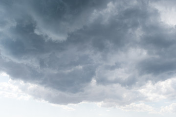 Stormy cumulus clouds of gray and blue background before a thunderstorm
