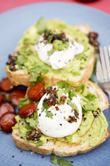 Toast spread with avocado, poached egg, chorizo & coriander 