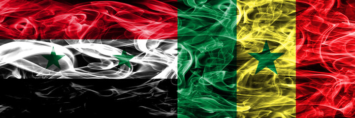 Syria vs Senegal smoke flags placed side by side. Thick colored silky smoke flags of Syrian and Senegal