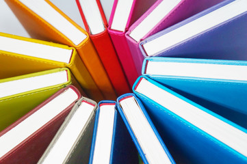 Books for colorful background. A lot of books with bright covers lined in circle. Design element,...