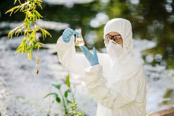 biologist working on water analysis. Ecology and environmental pollution concept.