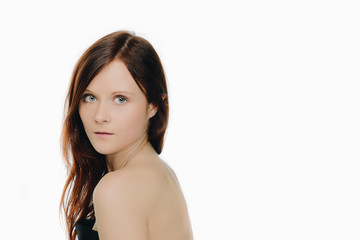 head shot of beautiful woman with blue eyes and dark red hair