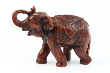 Brown elephant made of resin like wood carving with candle holder with white ivory. Stand on white background, Isolated, Art Model Thai Crafts, For decoration Like in the spa.
