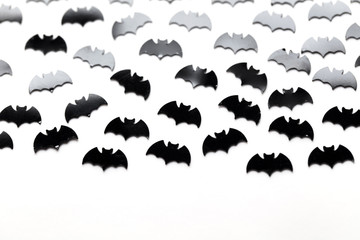 Black bat shapes on a white background. Halloween background