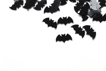 Black bat shapes on a white background. Halloween background