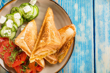 Sandwiches with cheese, tomatoes and cucumber.