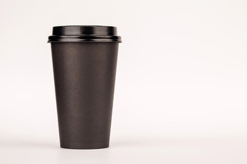 black paper Cup with a lid. Cup for coffee on white background.
