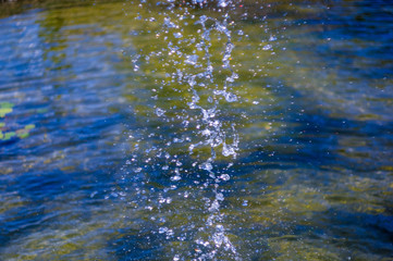 transparent falling water vertical flows, close up