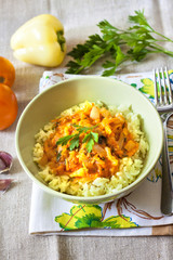 Steamed rice with stewed vegetables and turmeric