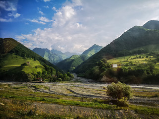 Fototapeta na wymiar Green mountains peaks during a summer