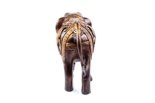 elephant made of resin like wooden carving with candle holder with white ivory. Stand on white background, Isolated, Art Model Thai Crafts, For decoration Like in the spa.