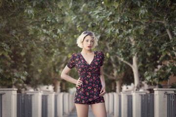 Portrait of a blonde girl in a city park