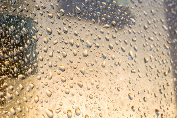 background of raindrops on window glass, close up