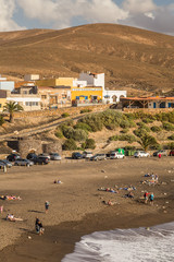 Fototapeta premium Waterfront cafes and restaurants in Ajuy, Fuerteventura, Canary Islands, Spain.