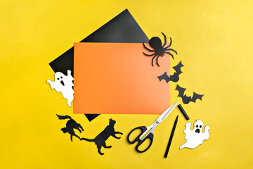 Crafts for Halloween - figures of a spider, bats, ghost and black cat, cut from black and orange...