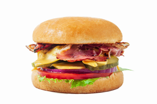 bacon burger with cheese and vegetables isolated at white background