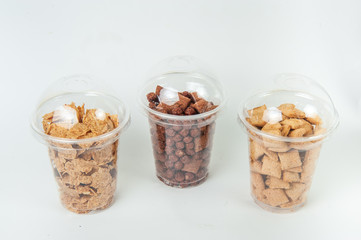cereal breakfast in transperent boxes at white background