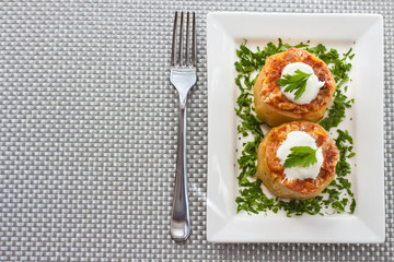 Zucchini stuffed with meat and vegetables