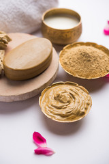 Obraz na płótnie Canvas Herbal or Ayurvedic face Pack using Multani mitti, milk etc placed with Soap, towel. Selective focus