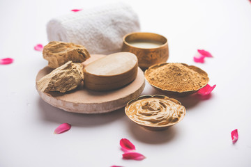 Herbal or Ayurvedic face Pack using Multani mitti, milk etc placed with Soap, towel. Selective focus