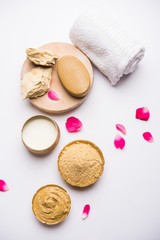 Herbal or Ayurvedic face Pack using Multani mitti, milk etc placed with Soap, towel. Selective focus