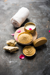 Herbal or Ayurvedic face Pack using Multani mitti, milk etc placed with Soap, towel. Selective focus