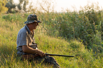 Hunter with a German trotter and spaniel, hunting a pheasant with dogs