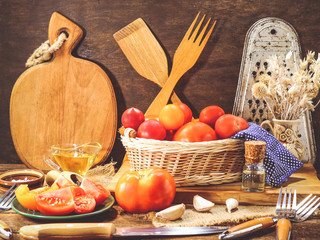 different tomatoes on a wooden background