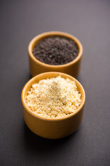 Rai or raw Mustard with sauce, powder and oil, over moody background. Selective focus
