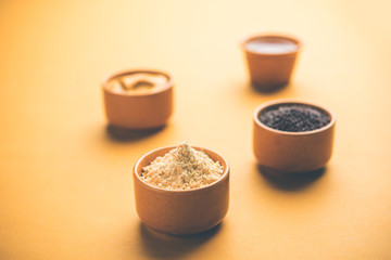 Rai or raw Mustard with sauce, powder and oil, over moody background. Selective focus
