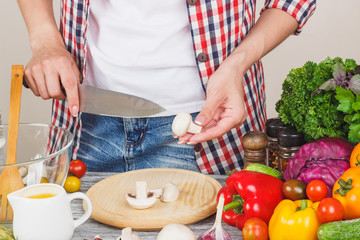 Woman cooks on the kitchen, soft focus background