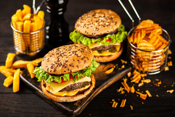 Delicious grilled burgers © George Dolgikh
