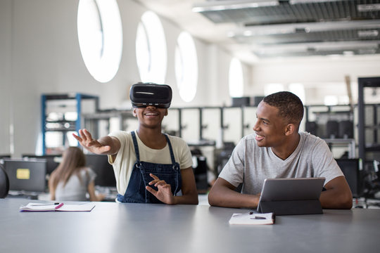 High school students using virtual reality headset in class