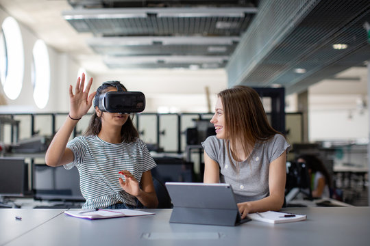 High school students using virtual reality headset in class