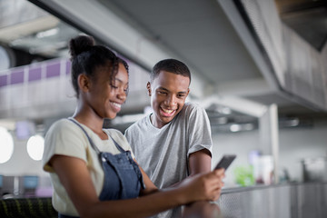 Students looking at smartphones at break time