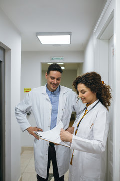 Two Physicians In A Hallway