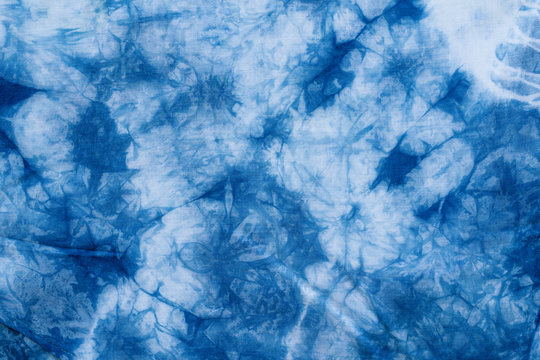 Pattern of blue dye on cotton cloth, Dyed indigo fabric background and textured