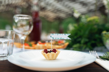 Elegant wedding table arrangement, floral decoration, restaurant. Wedding table setup. Wedding in the forest