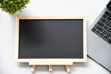 flat lay blackboard and Laptop On the desk with space for your text