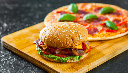 bacon cheese burger with beef patty tomato onion and Pizza with Mozzarella cheese, Ham, Tomatoes,...