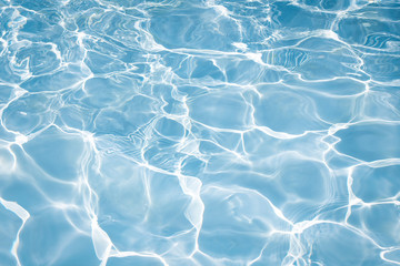 Texture of water in swimming pool for background