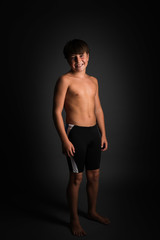 Fototapeta na wymiar Studio portrait of boy swimmer