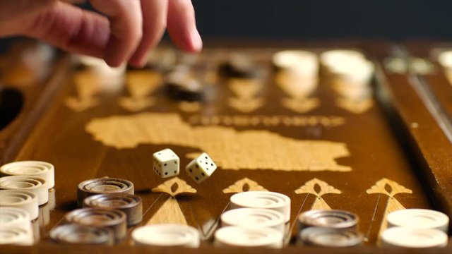 Throwing dices to backgammon board