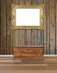 Interior with old wooden chest and golden antique frame at wall