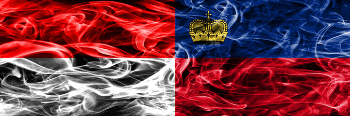 Indonesia vs Liechtenstein smoke flags placed side by side. Thick colored silky smoke flags of Indonesian and Liechtenstein