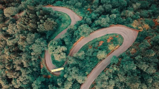 Aerial View landscape serpentine road winding on the mountains background in summer sunny day, Drone 4K Video