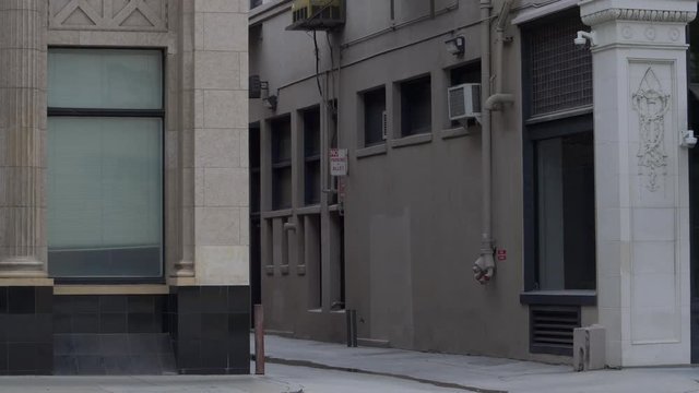END OF AN URBAN ALLEY.  ESTABLISHING SHOT IN 4K.
