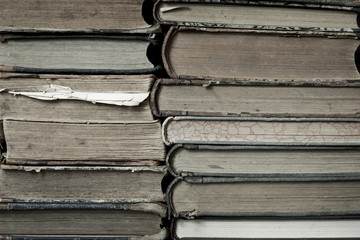 A stack of old tattered books.