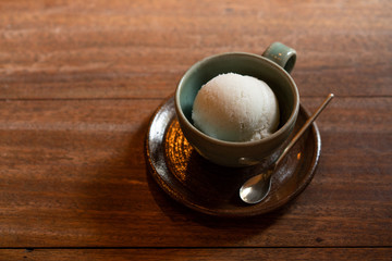 cup of ice cream on wooden vintage Table