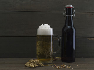 a glass of beer on a wooden background. 